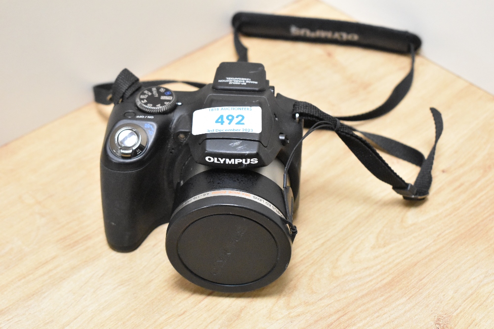 An Olympus SP-590UZ digital camera with Wide Zoom Olympus ED 26X 4,6-119.6mm 1:2,8-5 lens