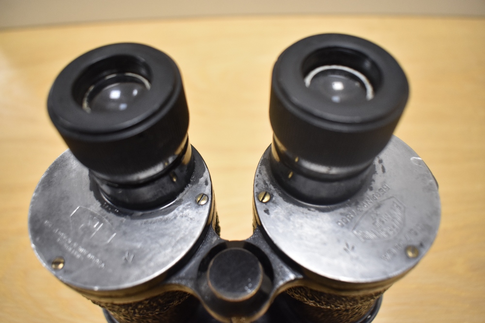 A pair of Bino Prismatic No5 MkIII X7 binoculars bearing the military crowsfoot mark in leather - Image 2 of 2