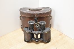 A pair of Dollond, London Prismatic X6 binoculars bearing military crowsfoot in leather case