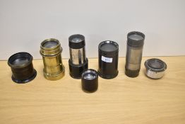 A group of seven brass and projection lenses including Zeiss Icon, Swift, Taylor & Hobson and