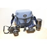 A Nikon EM camera No7148725 with Nikon Series E 1:1,8 50mm lens, a Tamron BPAR Multi C 1:3,5 200mm