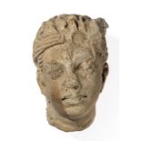 A GANDHARA STUCCO HEAD OF A DEVOTEE, NORTH-WESTERN PAKISTAN, 4TH/5TH CENTURY