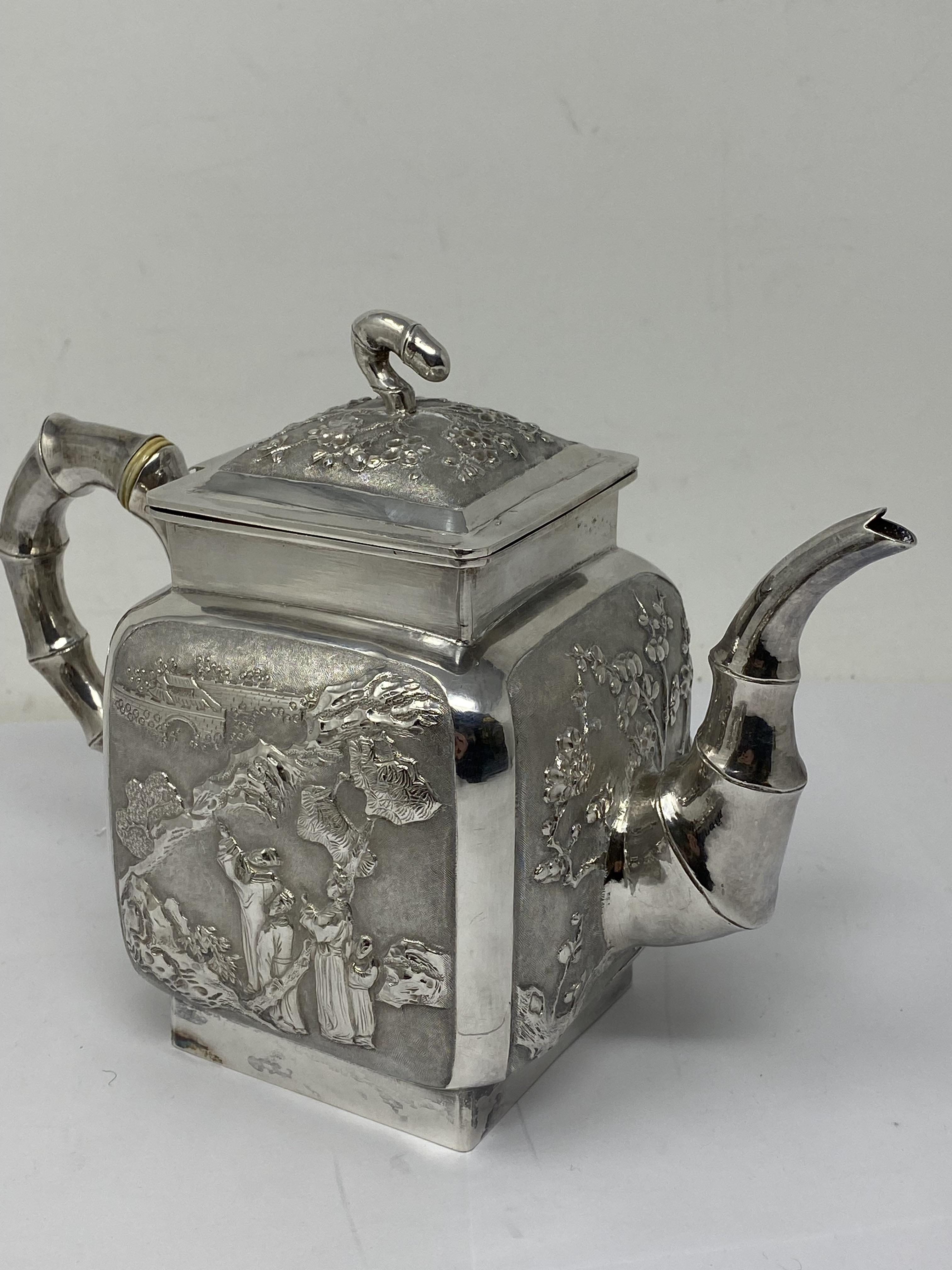 ˜A CHINESE SILVER MATCHED THREE-PIECE TEA SET, WANG HING, CANTON AND HONG KONG,CIRCA 1890 - Image 7 of 13