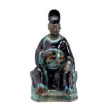 A CHINESE FAHUA FIGURE OF A DIGNITARY, LATE MING DYNASTY .