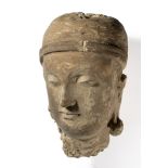 A GANDHARA STUCCO HEAD OF A DEVOTEE, NORTH-WESTERN PAKISTAN, 4TH/5TH CENTURY