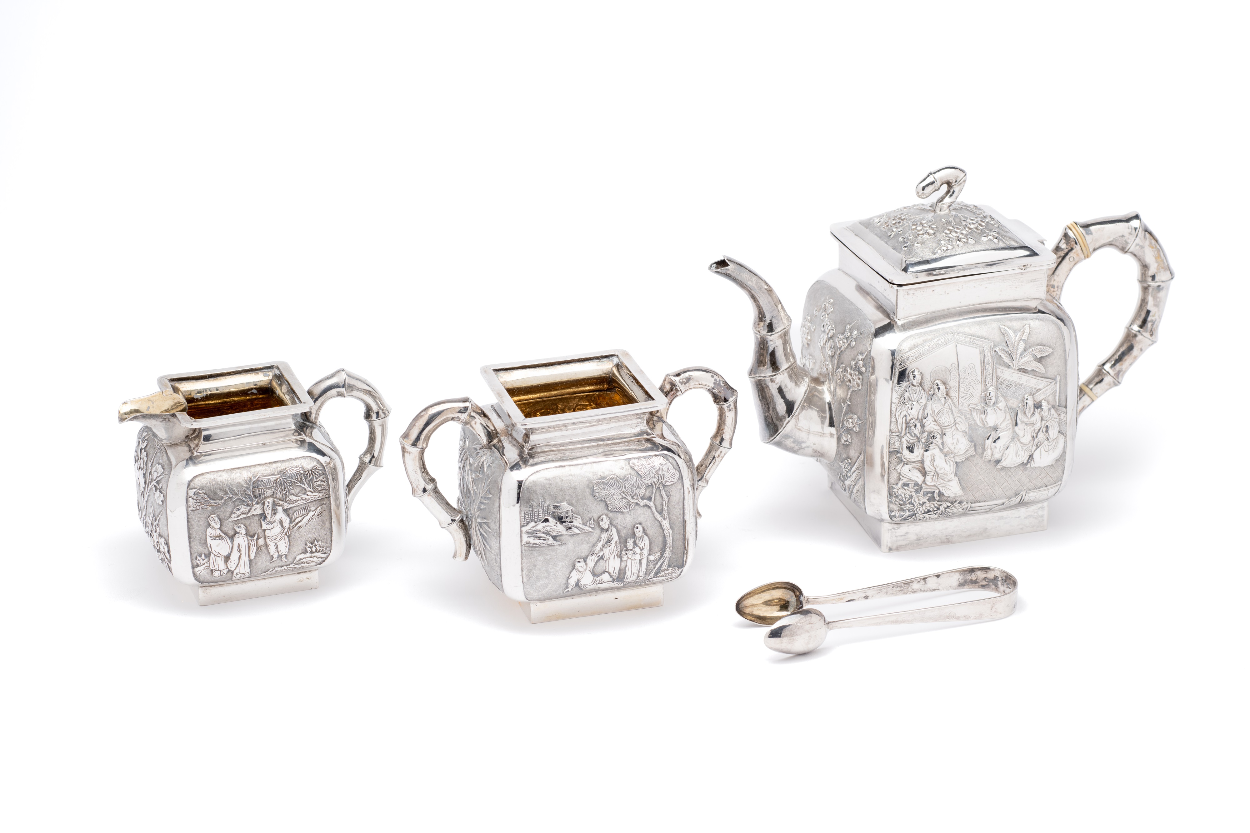 ˜A CHINESE SILVER MATCHED THREE-PIECE TEA SET, WANG HING, CANTON AND HONG KONG,CIRCA 1890