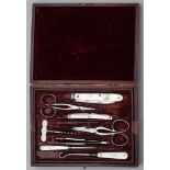 A MOTHER-OF-PEARL MOUNTED MANICURE SET, MACDANIEL, OXFORD STREET, EARLY 20TH CENTURY AND A CASED