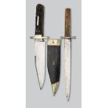 A BOWIE KNIFE, G. WOSTENHOLM & SON, WASHINGTON WORKS, SHEFFIELD, EARLY 20TH CENTURY AND A DAGGER