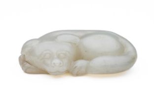 A CHINESE CELADON-WHITE JADE DOG, QING DYNASTY (1644-1911)