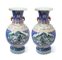 A LARGE AND FINELY ENAMELLED PAIR OF CHINESE FAMILLE-ROSE BALUSTER VASES, QING DYNASTY, 19TH