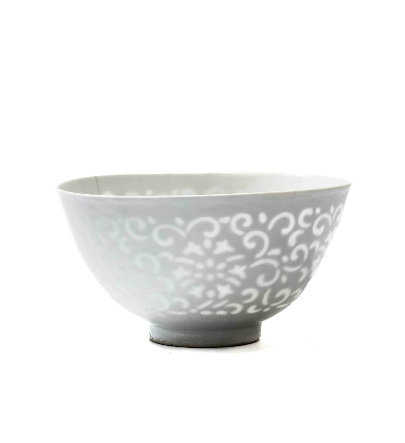 A RARE CHINESE WHITE-GLAZED 'OPEN-WORK' 'LOTUS' BOWL, QING DYNASTY (1644-1911)