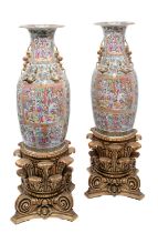 A LARGE PAIR OF CANTON FAMILLE-ROSE BALUSTER VASES, QING DYNASTY, 19TH CENTURY