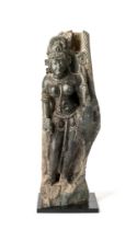 A BLACK STONE FIGURE OF AN ATTENDANT, RAJASTHAN, 11TH/12TH CENTURY