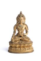 A SINO-TIBETAN GILT BRONZE FIGURE OF RATNASAMBHAVA, 18TH CENTURY