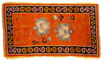 A TIBETAN RUG, 20TH CENTURY