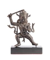 ˜ A BRONZE FIGURE OF ACALA, TIBET, CIRCA 15TH CENTURY