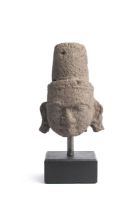A VOLCANIC STONE HEAD OF A DEITY, PROBABLY SIVA, MAHARASHTRA, CIRCA 10TH CENTURY