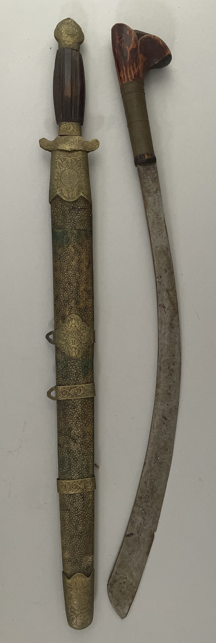 A CHINESE SWORD (DAO) AND THREE MALAYSIAN DAGGERS, LATE 19TH/EARLY 20TH CENTURY