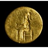 A RARE LATE CLASSICAL GREEK GOLD RING WITH THE ENGRAVED BEZEL. ATHENA SEATED IN FRONT OF A THYMATERI