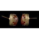A PAIR OF CARNELIAN ETRUSCAN SCARABS SET IN GOLD EARRINGS. VARIOUS SUBJECTS.