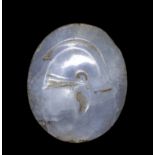 A LARGE GREEK BLUE CHALCEDONY ENGRAVED SEAL. HELMET.