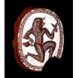 A GREEK CARNELIAN SCARAB. RUNNING SATYR.