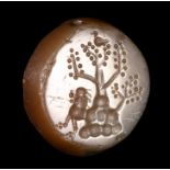 A GRAECO-PERSIAN/CENTRAL ASIA CHALCEDONY ENGRAVED SEAL. LION WITH A TREE.