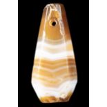 A NEAR EASTERN BANDED AGATE BEAD PENDANT.