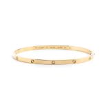 CARTIER, Love collection: rigid golden bracelet with diamonds