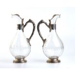 A pair of silver and cut glass claret jugs and cut glass - France early 1900s, mark of AMÉLIE CARDE