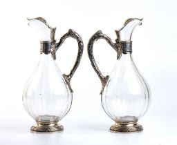 A pair of silver and cut glass claret jugs and cut glass - France early 1900s, mark of AMÉLIE CARDE