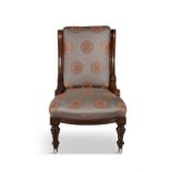 A VICTORIAN MAHOGANY FRAMED LADIES ARMCHAIR upholstered in grey fabric with decorated with
