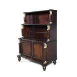 A 19TH CENTURY MAHOGANY AND ORMOLU MOUNTED WATERFALL BOOKCASE IN THE STYLE OF THOMAS HOPE,