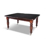 A LATE VICTORIAN MAHOGANY RECTANGULAR EXTENDED DINING TABLE with reeded rim, two additional