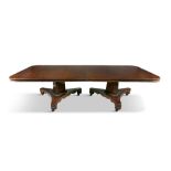 A GEORGE IV MAHOGANY DINING TABLE, of rectangular form with moulded rim, raised on two