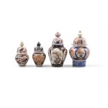 A COLLECTION OF FOUR JAPANESE IMARI BALUSTER JARS AND COVERS, of varying size, some with assorted