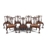 A SET OF SEVEN MAHOGANY CHIPPENDALE DINING CHAIRS, EARLY 20TH CENTURY, elaborately carved with
