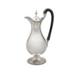 A GEORGE III SILVER CLARET JUG London c.1787, mark of Hester Bateman, the plain hinged lid with