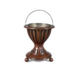 A WILLIAM IV ROSEWOOD AND BRASS LINED CIRCULAR JARDINERE STAND, of hourglass form,