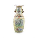 A CHINESE FAMILLE JEUNE BALUSTER VASE QING DYNASTY decorated with panels of songbird and