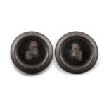 TWO MINIATURE WAX PORTRAIT BUST RELIEFS, in military blue jackets, in circular frames. (2),