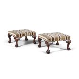A PAIR OF MAHOGANY FRAMED UPHOLSTERED LOW STOOLS, each covered in a brown and cream striped