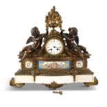 A FRENCH 19TH CENTURY BRONZE AND GILT BRASS MANTLE CLOCK the white enamel drum dial signed