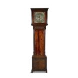 AN EARLY 19TH CENTURY MAHOGANY LONGCASE CLOCK, the flat topped hood enclosing a brass dial with
