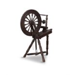 A 19TH CENTURY STAINED WOOD SPINNING WHEEL. 99cm high