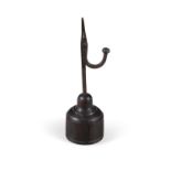 A 19TH CENTURY FORGED IRON TABLE RUSH LIGHT on a circular turned wooden base. 21.5cm high