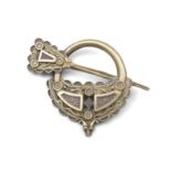 AN IRISH SILVER-GILT TARA BROOCH, of "West & Son College Green, Dublin", embellished with Celtic