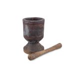 A LARGE 19TH CENTURY STAINED PINE PESTLE AND MORTAR, of cylindrical form, raised on waisted