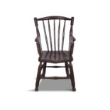 A 19TH CENTURY PAINTED PINE CURVED RAILBACK ARMCHAIR, the spindle and dished saddle seat,