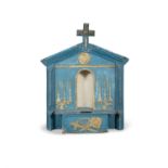 A BLUE AND GOLD PAINTED SHRINE, the stepped carved columns enclosing, a central niche with shelf.